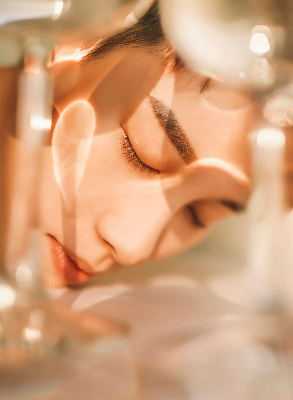 Soft, warm portrait of a woman with closed eyes